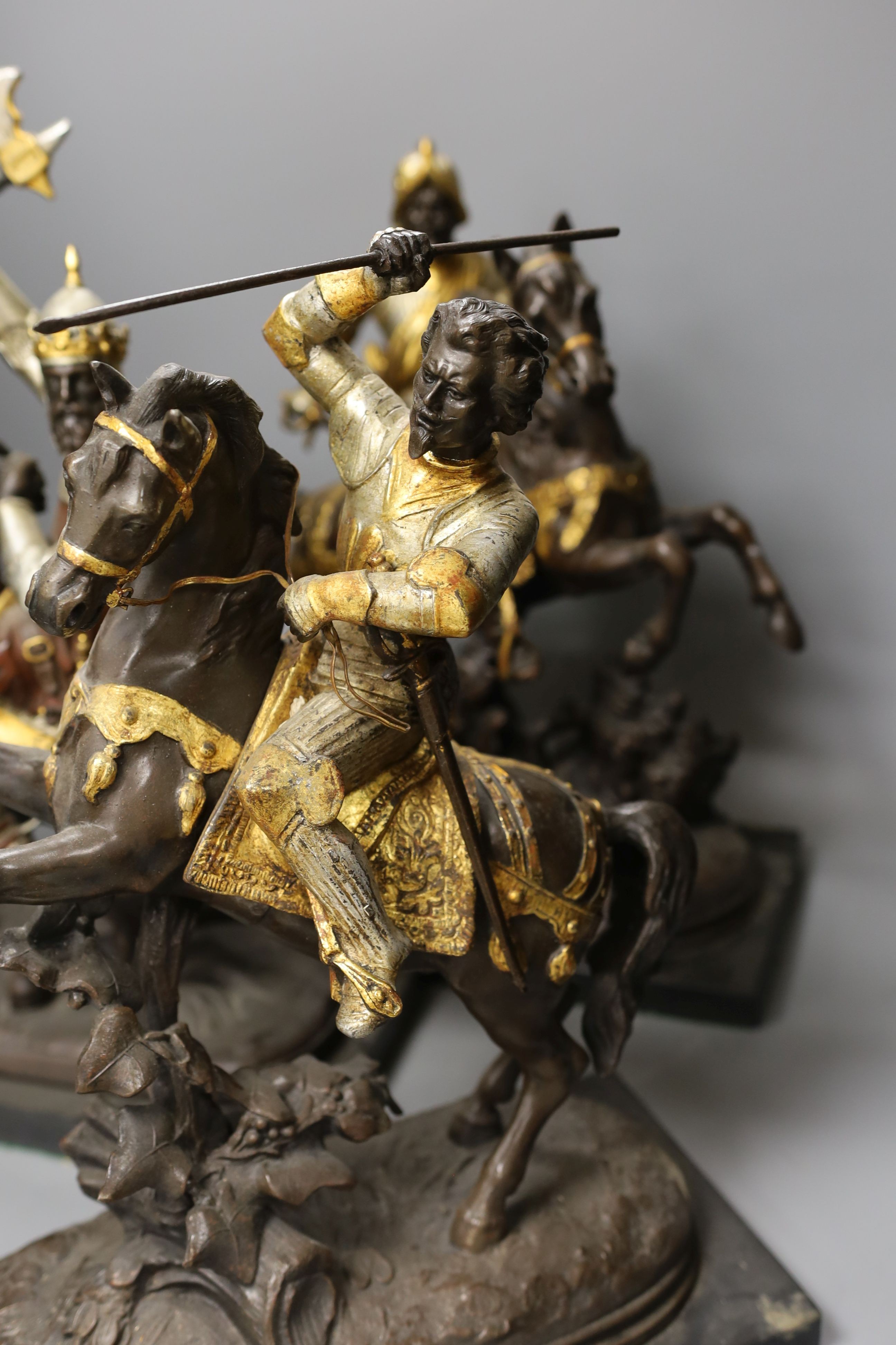 Three spelter warriors on horseback - tallest 43cm